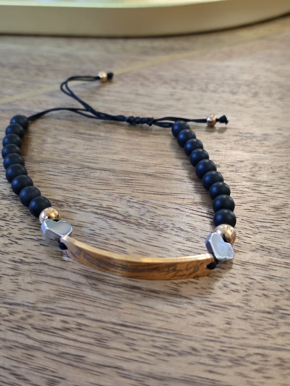 Matte Black Beaded Bracelet with Gold Accent Bar